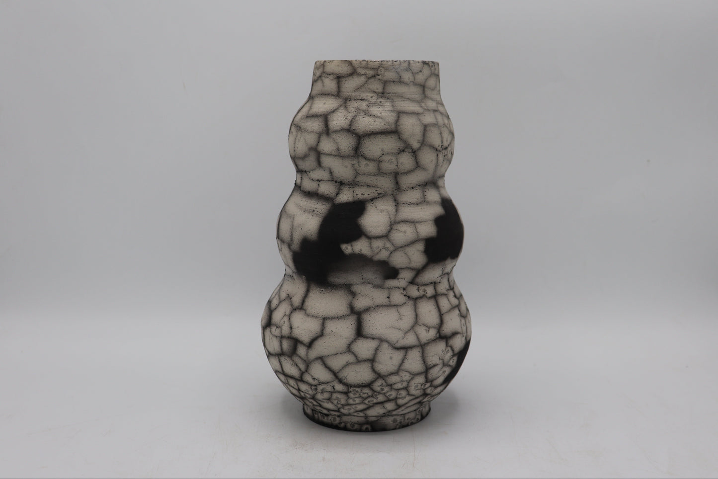 Raku vase made from white Raku clay and fired in Naked Raku firing technique