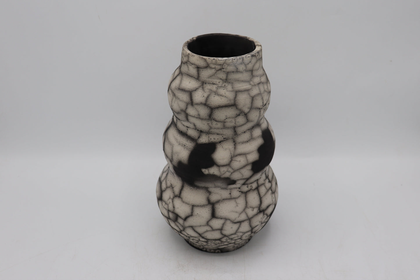 Raku vase made from white Raku clay and fired in Naked Raku firing technique