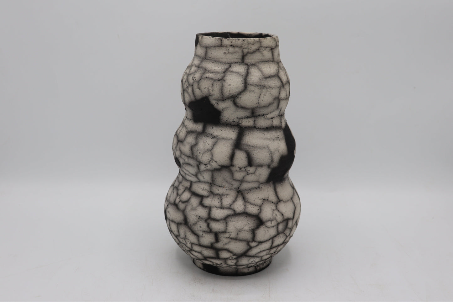Raku vase made from white Raku clay and fired in Naked Raku firing technique