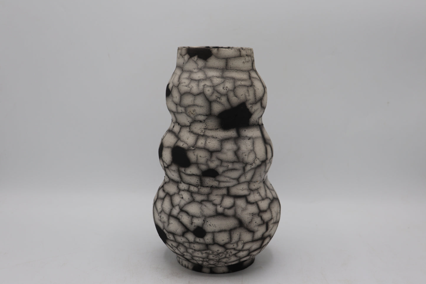 Raku vase made from white Raku clay and fired in Naked Raku firing technique