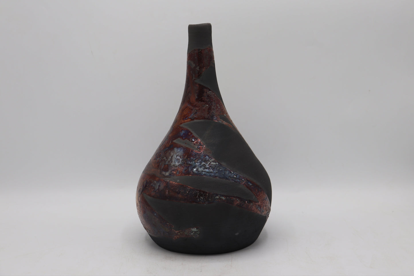 Raku vase made from white Raku Clay and copper Raku Glaze