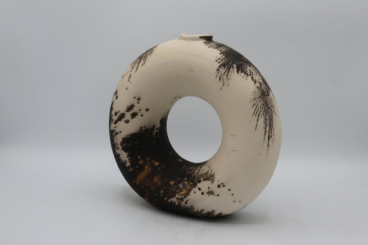 Raku vase made from white Raku clay and fired in Obvara firing technique