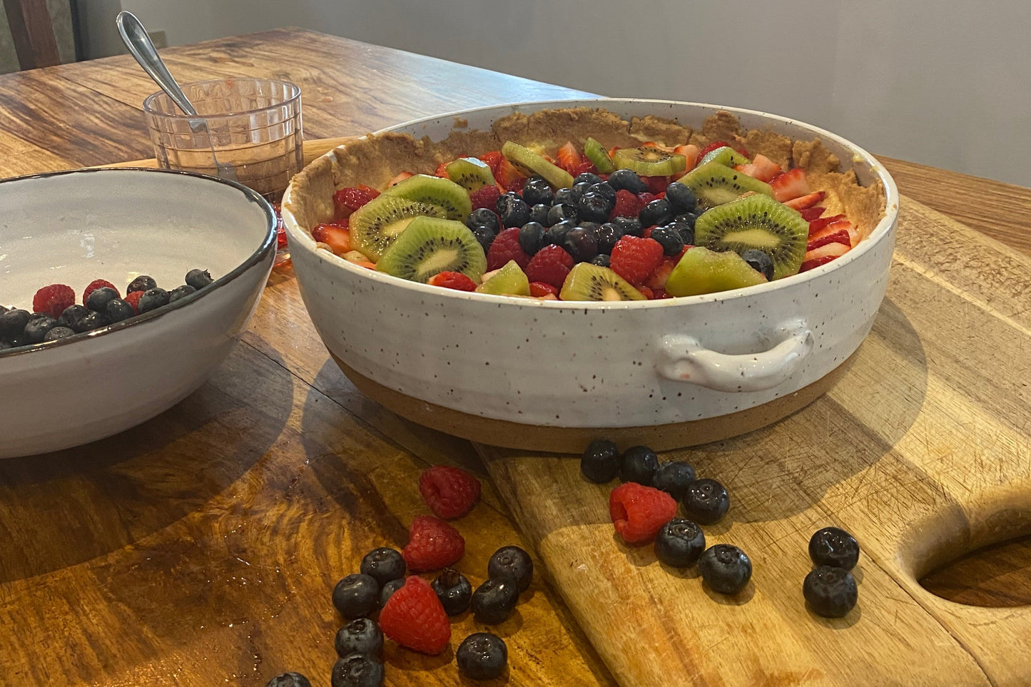 Mother's day fruit tart in a green and blue casserole dish