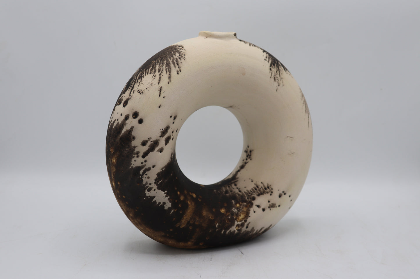 Raku vase made from white Raku clay and fired in Obvara firing technique