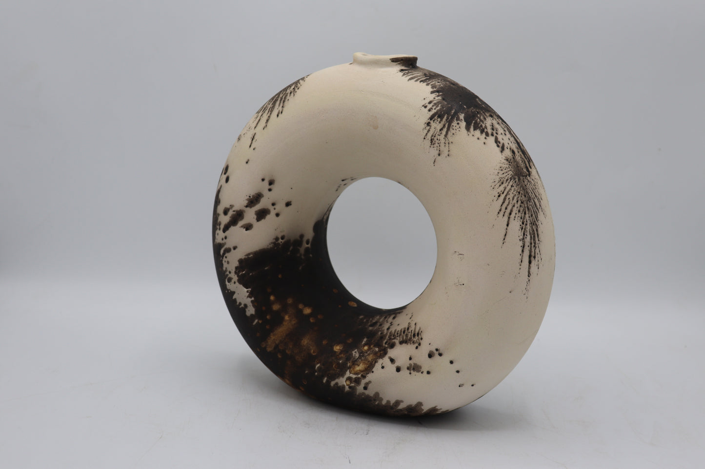 Raku vase made from white Raku clay and fired in Obvara firing technique