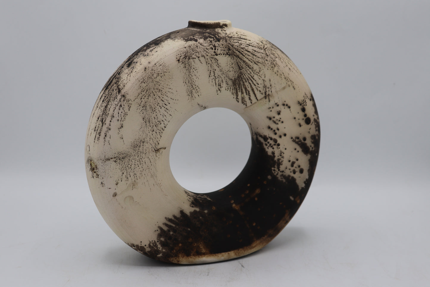 Raku vase made from white Raku clay and fired in Obvara firing technique