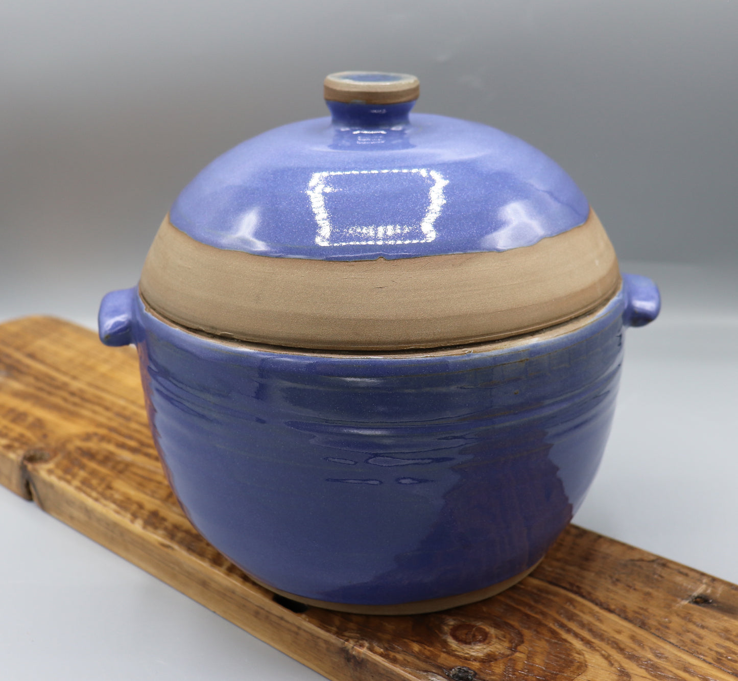 Blue-glazed stoneware casserole dish with lid