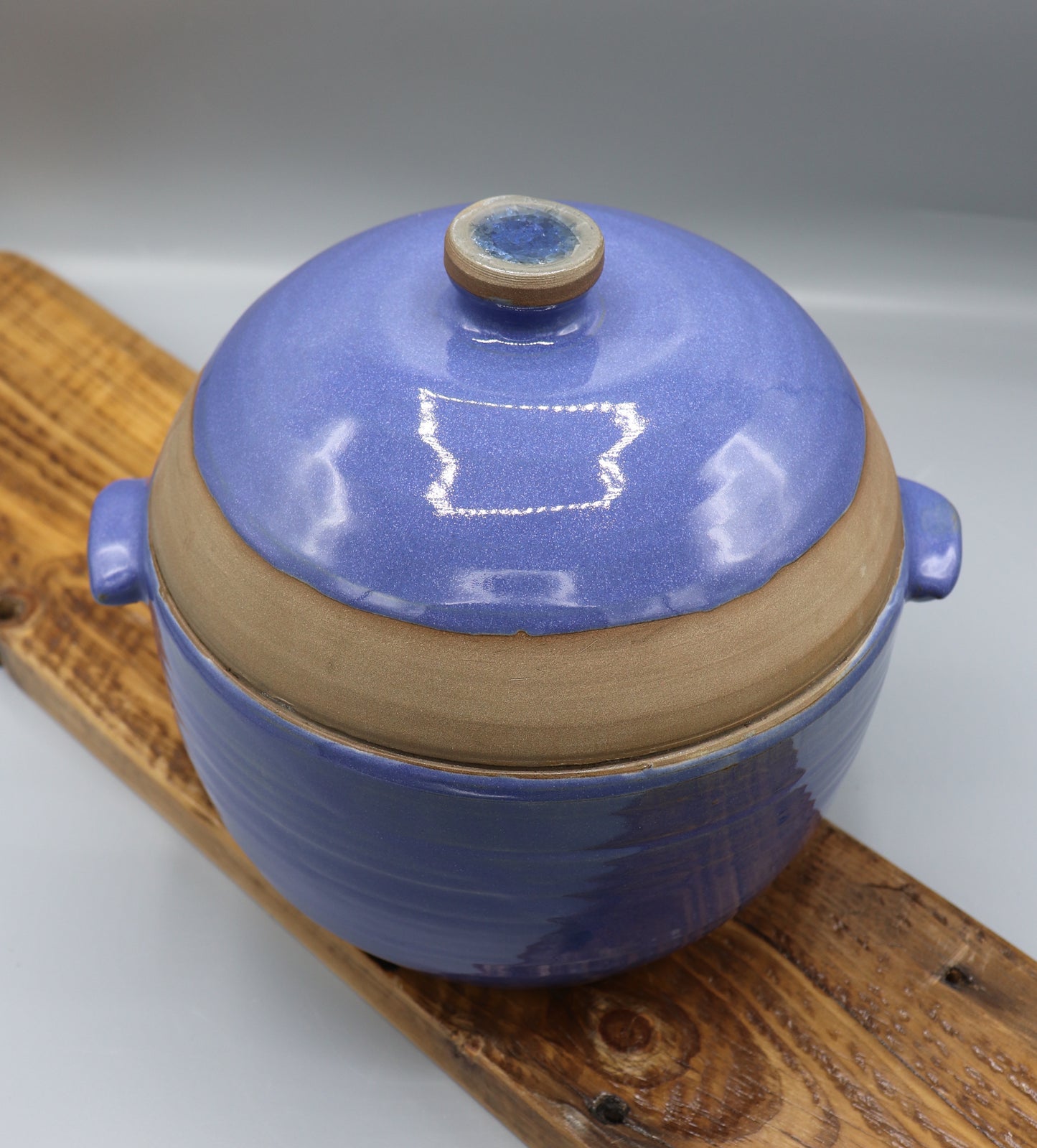 Blue-glazed stoneware casserole dish with lid