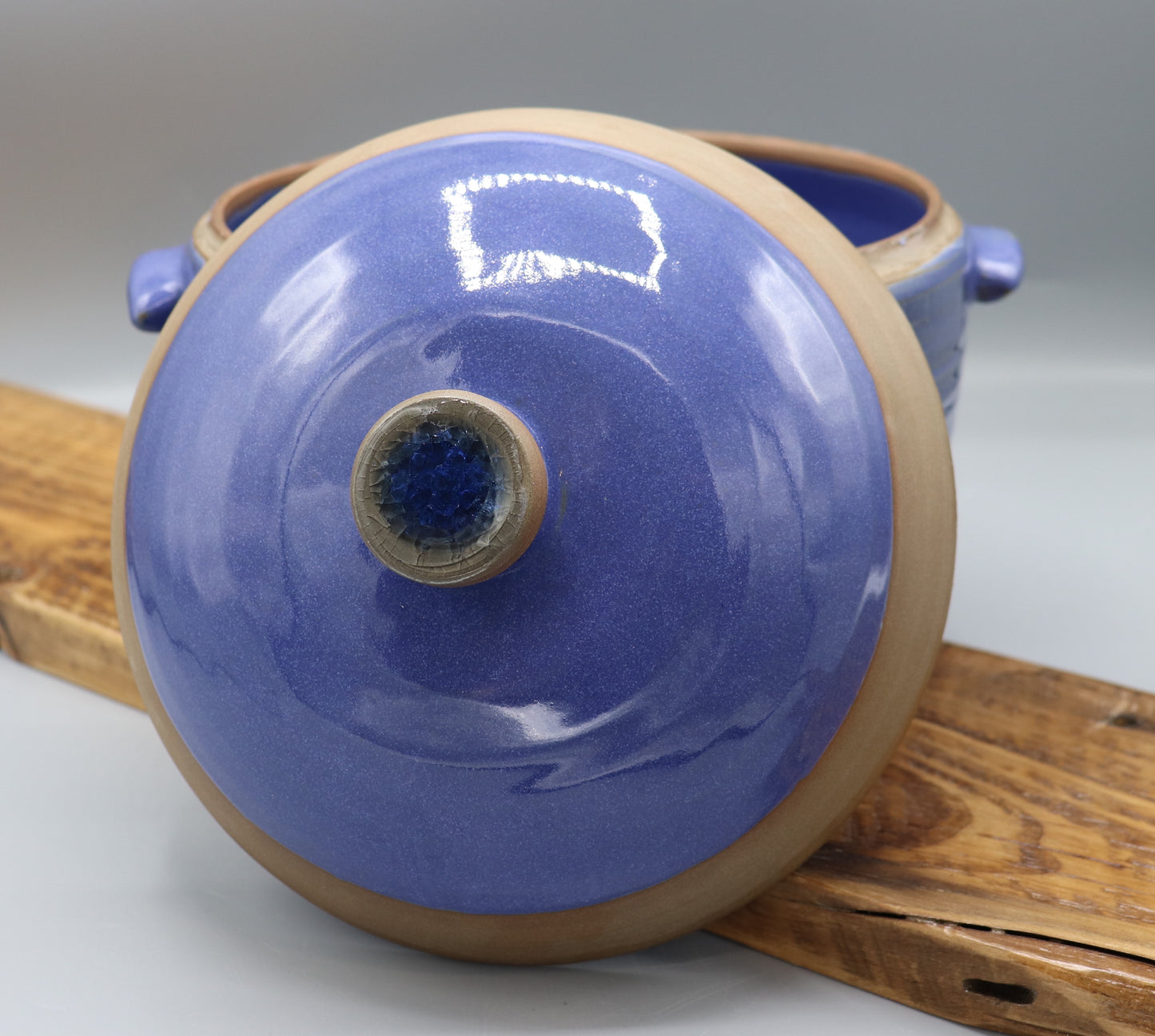 Blue-glazed stoneware casserole dish with lid